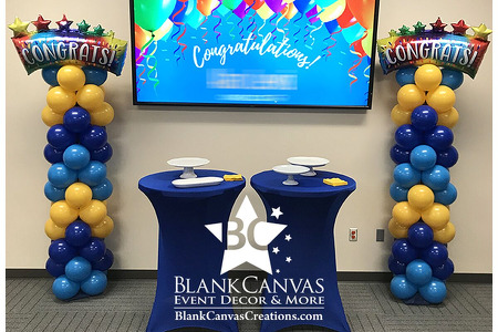 Corporate award ceremony balloon columns in a chevron pattern with a congratulations balloon on top.