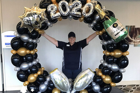 Deluxe Balloon Photo Frame with 9' round balloon frame with champagne, glasses, 2020 and Happy New Year foils on front.