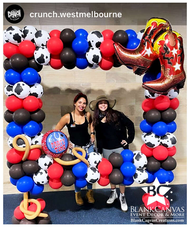 Our cowboy/country themed balloon photo frame with the some of the staff from Crunch fitness in the frame. 