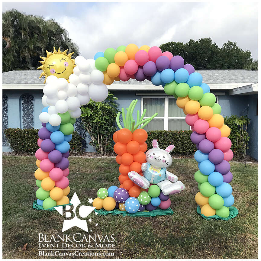 Rainbow, Sun and Cloud Balloon Arch with Easter and Carrot Sculpture in Melbourne FL