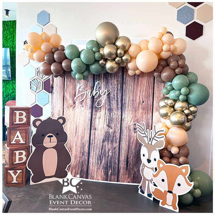 Woodland Baby Shower Balloon Decor and Backdrop Melbourne FL at Hotel Melby. Sage, Tans and Cameo colored organic balloon garland around a customer's backdrop.